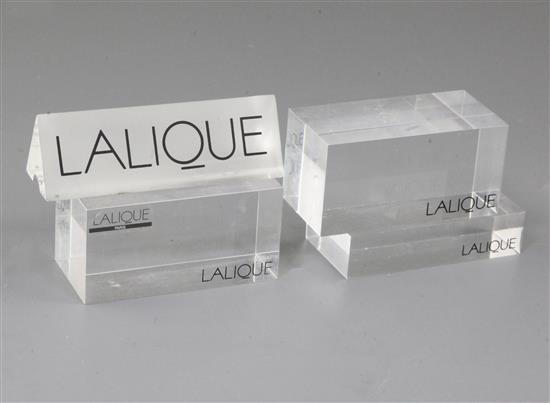 A Lalique perspex display case label and four block base labels, 9.75cm and 8cm.